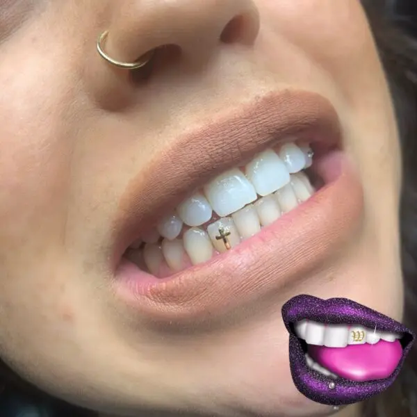 A woman with purple lips and white teeth.