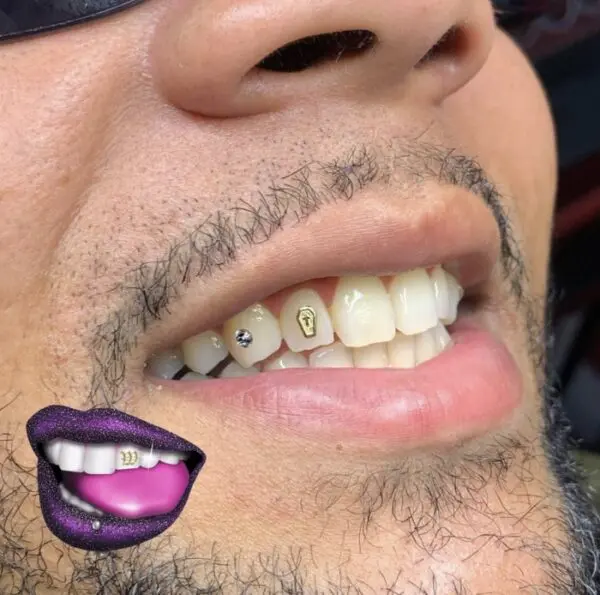 A man with purple lips and white teeth.