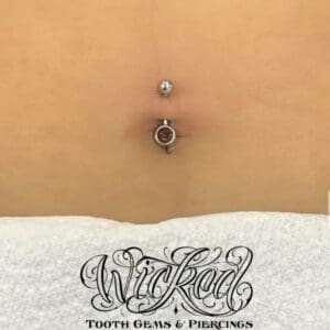 A close up of the belly button piercing