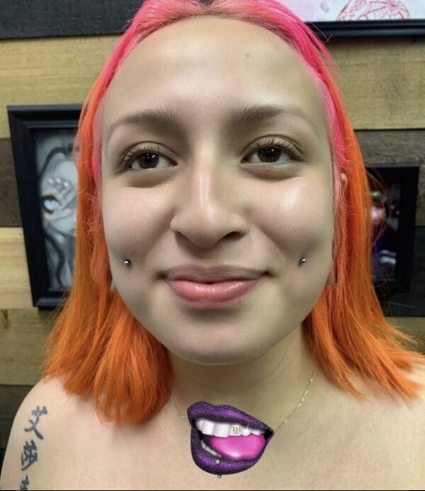 A woman with orange hair and pink lips.