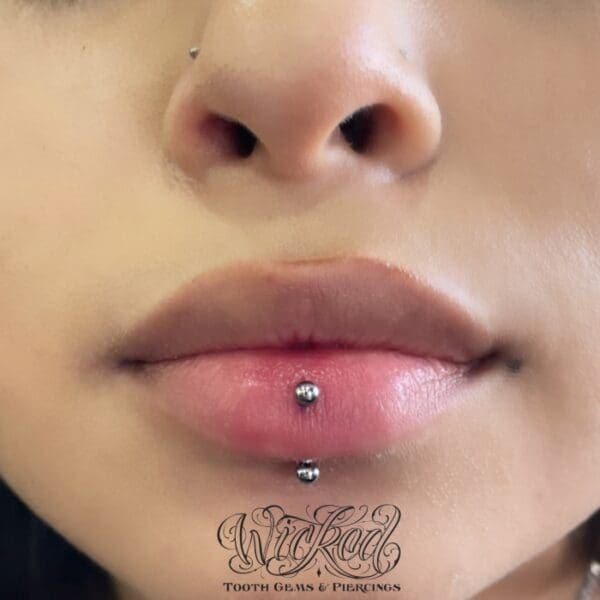 A woman with a piercing on her lip.