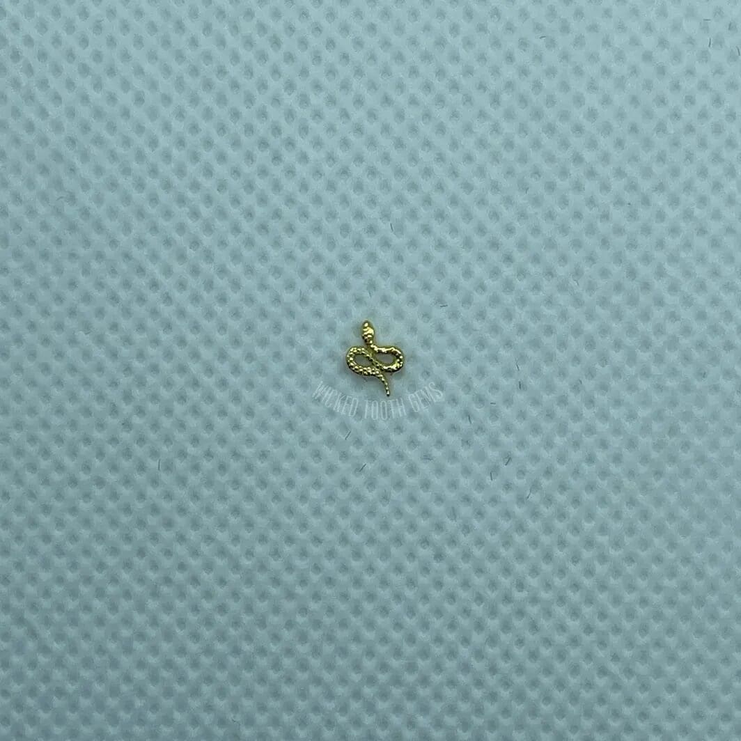 A small yellow object sitting on top of a blue surface.