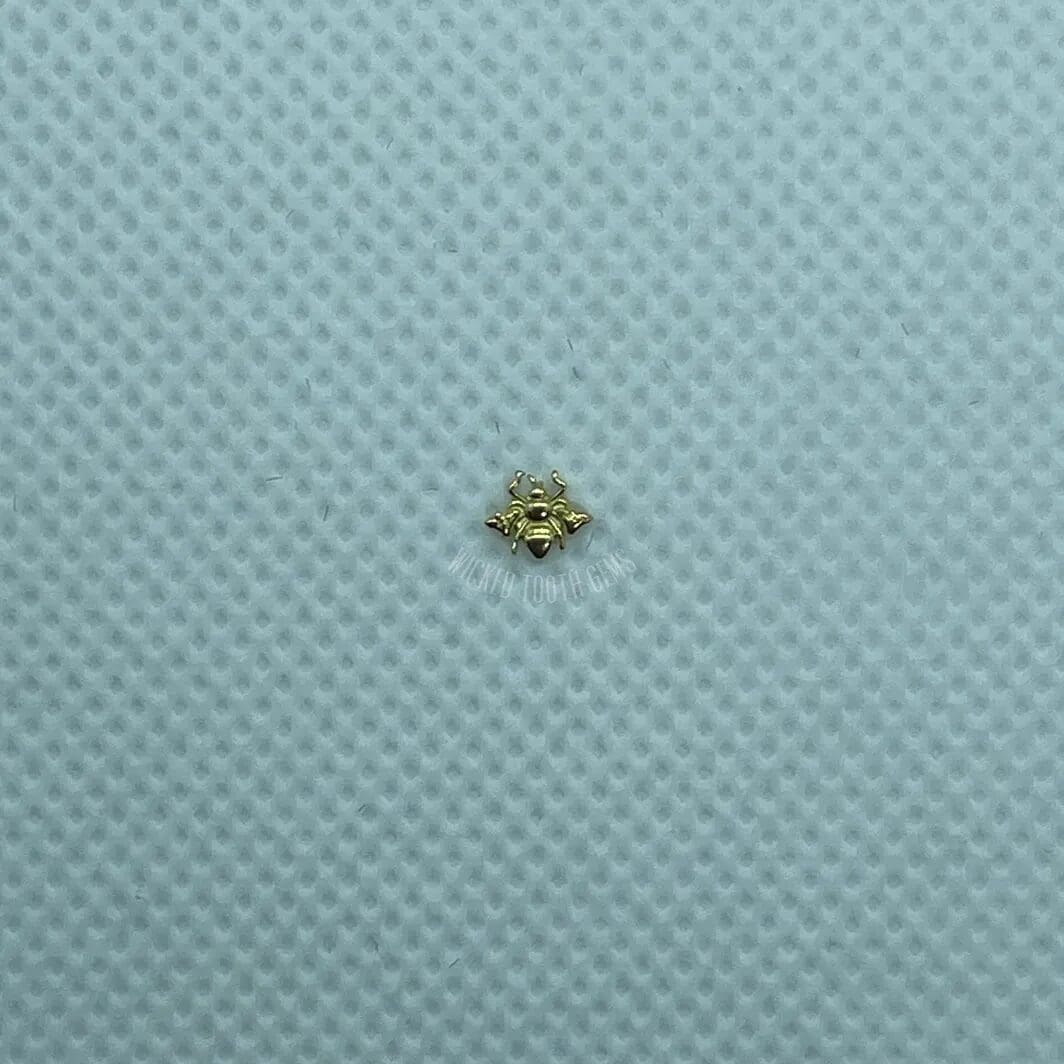 A small yellow object sitting on top of a blue surface.