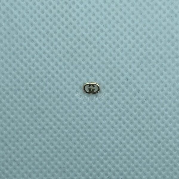 A small object sitting on top of a blue surface.