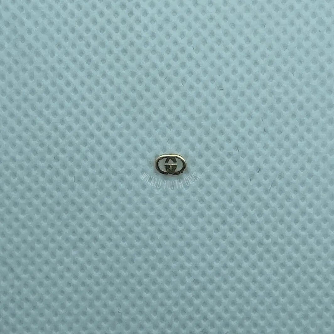 A small object sitting on top of a blue surface.