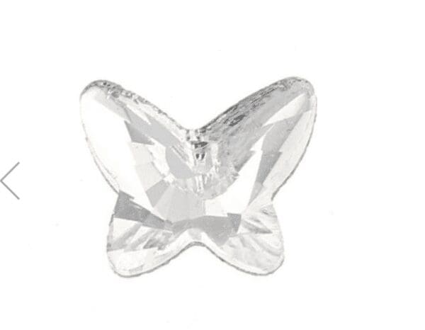 A white butterfly shaped object with a shiny finish.