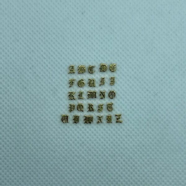 A square of gold letters on top of a blue surface.