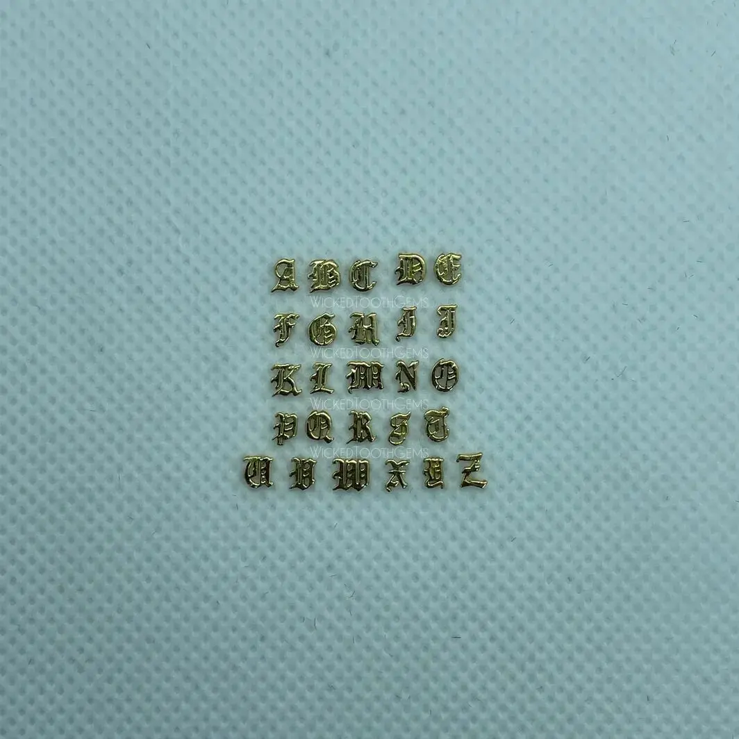 A square of gold letters on top of a blue surface.