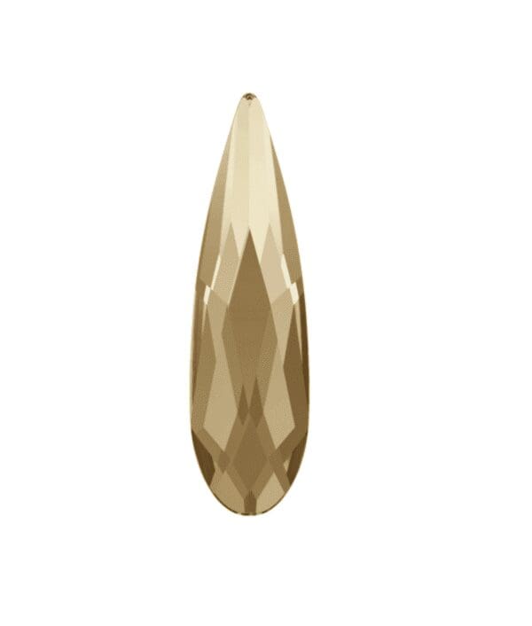 A gold colored crystal is shown.