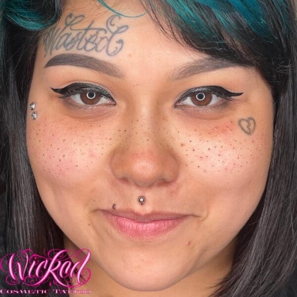 A woman with tattoos on her face and neck.