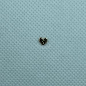 A heart shaped object sitting on top of a blue surface.