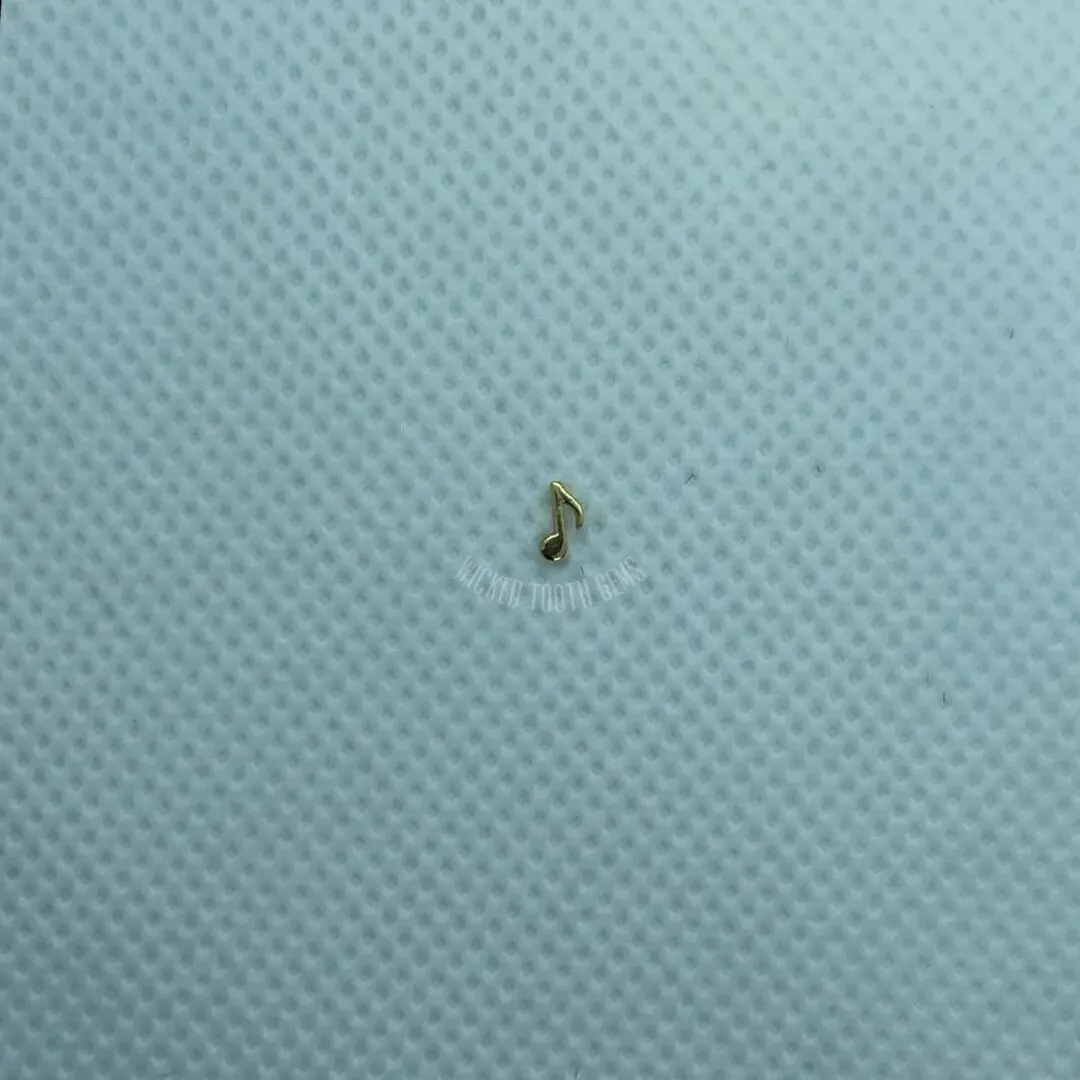 A tiny insect is sitting on the surface of a sheet.