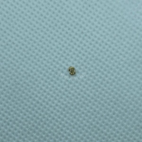 A small object is sitting on top of the fabric.