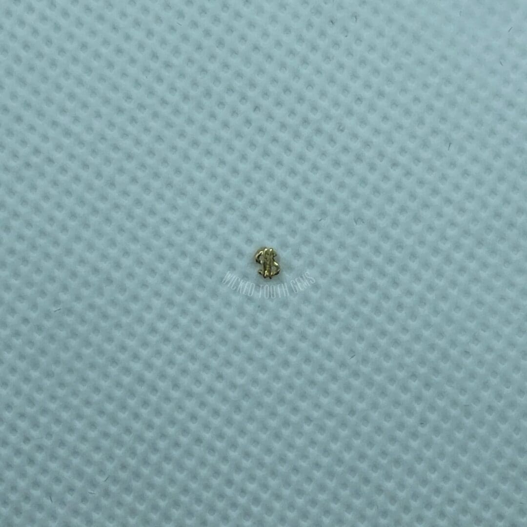 A small object is sitting on top of the fabric.