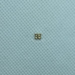 A small butterfly is sitting on top of the blue cloth.