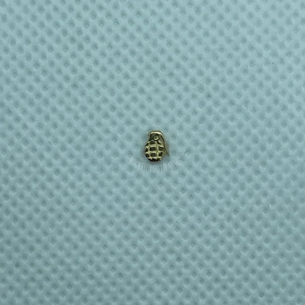 A close up of a tiny object on top of a blue surface.