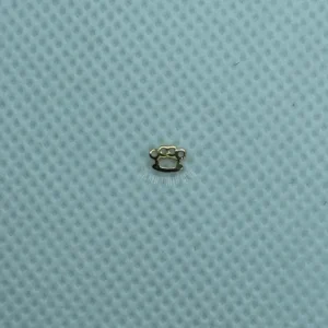 A close up of the small object on top of a blue cloth.