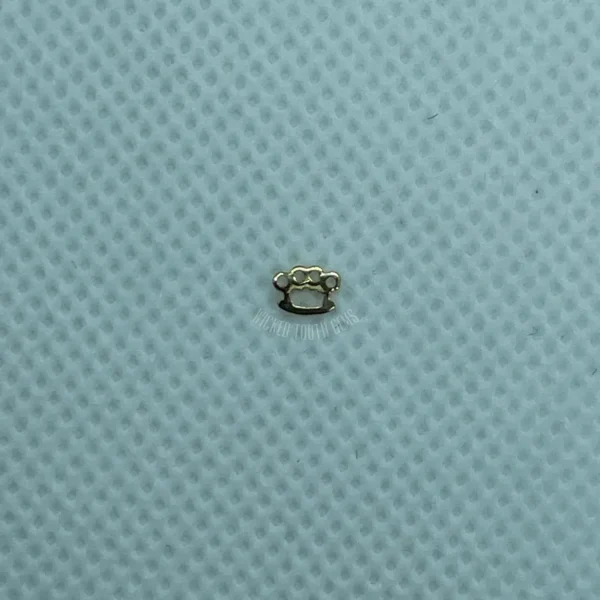 A close up of the small object on top of a blue cloth.