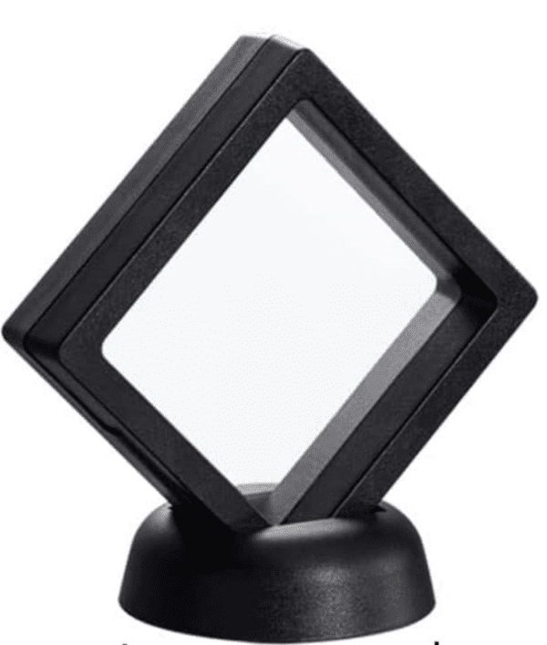 A black square shaped object on top of a stand.