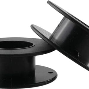 A pair of black plastic spools with one spool missing.