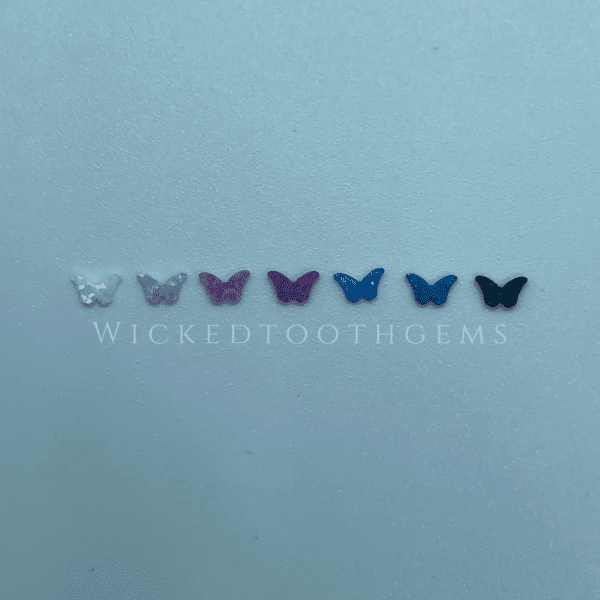 A group of butterflies that are sitting on the wall.