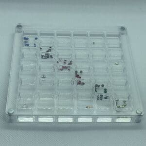 A clear plastic tray with many different items on it.