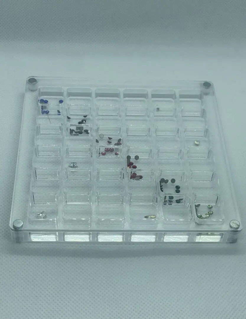 A clear plastic tray with many different items on it.